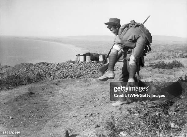 Gallipoli 1915, An Australian carrying his wounded mate to a medical aid post for treatment, Gallipoli, 1915.