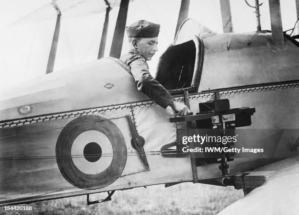 Photography During The First World War, A sergeant of the Royal Flying Corps demonstrates a C type aerial reconnaissance camera fixed to the fuselage...