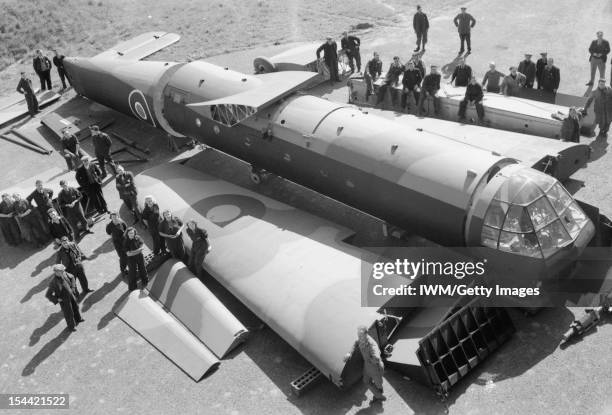 Royal Air Force Maintenance Command, 1939-1945, Civilian workers pose with sections of an Airspeed Horsa glider, as received from the manufacturers,...