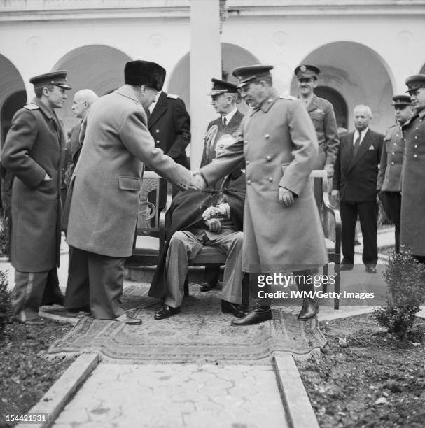 The Yalta Conference, February 1945, Winston Churchill shakes hand with Joseph Stalin outside the Livadia Palace during the Yalta Conference....