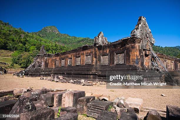 the ancient ruins of wat phou. - wat stock pictures, royalty-free photos & images