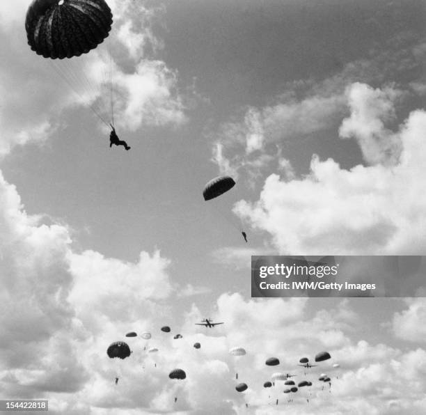 The Parachute Regiment In Training, Ringway, August 1942, Paratroops descend from a Whitley.