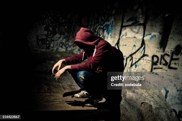 man desperate and alone - homeless man stock pictures, royalty-free photos & images