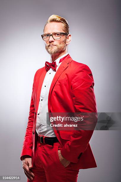 man in red suit - red suit stockfoto's en -beelden