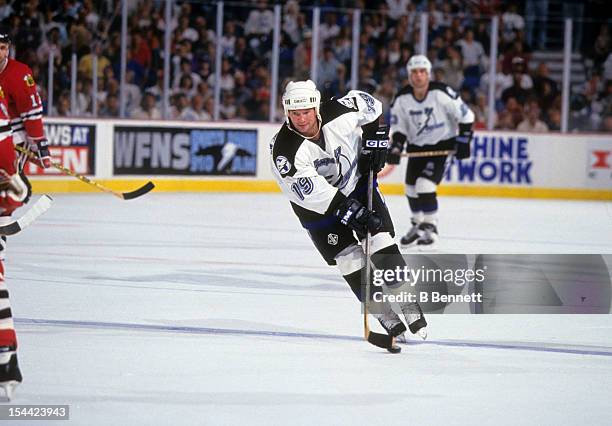 Brian Bradley of the Tampa Bay Lightning skates with the puck during an NHL game against the Chicago Blackhawks on November 20, 1993 at the...