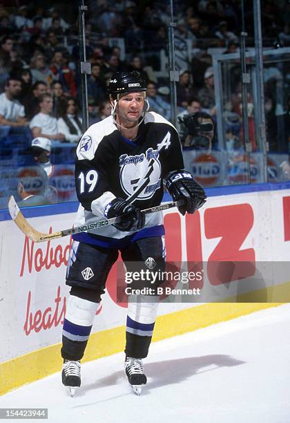 Brian Bradley of the Tampa Bay Lightning skates on the ice during an NHL game against the New York Islanders circa 1995 at the Nassau Coliseum in...