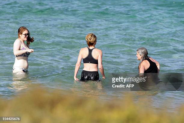 Guests of US actors Justin Timberlake and fiance Jessica Biel take a bath in the sea at the Bagno Egnazia resort in Fasano, in the southern Italian...