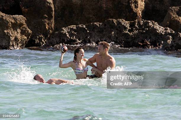 Guests of US actors Justin Timberlake and fiance Jessica Biel take a bath in the sea at the Bagno Egnazia resort in Fasano, in the southern Italian...