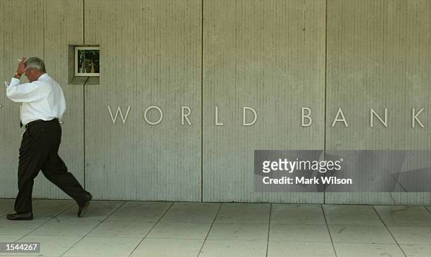 Man walks past the front of the World Bank building May 21, 2002 in Washington, DC. Preliminary tests at the World Bank detected possible anthrax...