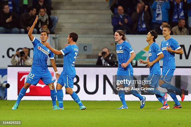 Roberto Firmino of Hoffenheim celebrates his team's first goal with team mates Kevin Volland, Sebastian Rudy, Takashi Usami and Joselu during the...