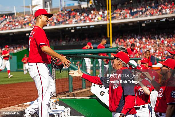 Gio Gonzalez exchanges emotion with Davey Johnson of the Washington Nationals after being taken out of the game at Nationals Park on Saturday,...