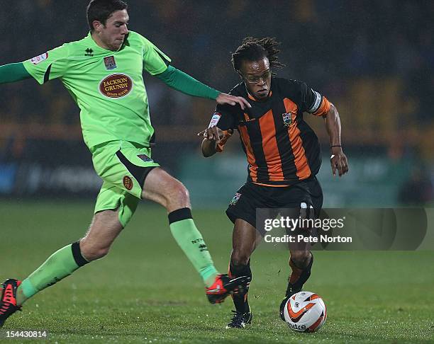Edgar Davids of Barnet attempts to move past ben Tozer of Northampton Town during the npower League Two match between Barnet and Northampton Town at...
