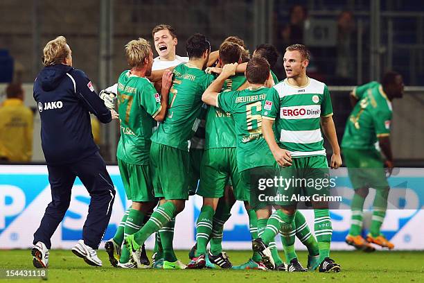 Lasse Sobiech of Greuther Fuerth celebrates his team's third goal with team mates and head coach Mike Bueskens during the Bundesliga match between...