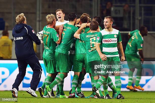 Lasse Sobiech of Greuther Fuerth celebrates his team's third goal with team mates and head coach Mike Bueskens during the Bundesliga match between...