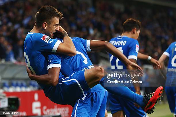 Joselu of Hoffenheim celebrates his team's second goal with team mate Marvin Compper during the Bundesliga match between 1899 Hoffenheim and SpVgg...