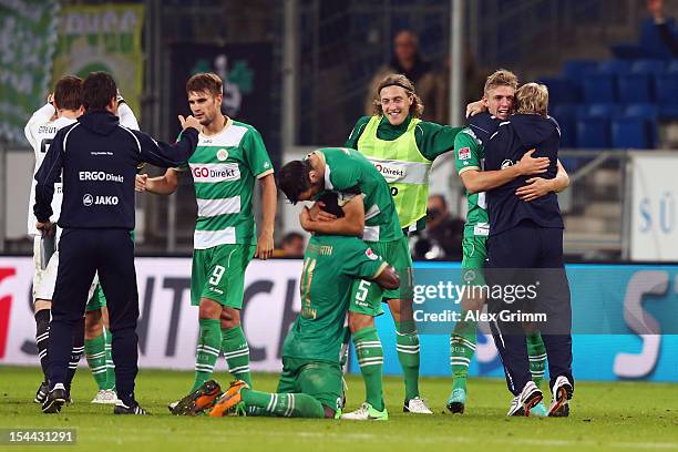 Lasse Sobiech of Greuther Fuerth celebrates his team's third goal with head coach Mike Bueskens and team mates after the Bundesliga match between...