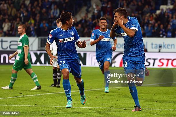 Joselu of Hoffenheim celebrates his team's third goal with team mate Roberto Firmino during the Bundesliga match between 1899 Hoffenheim and SpVgg...