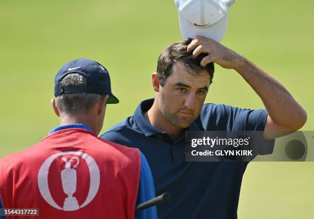 Golfer Scottie Scheffler completes the course on day one of the 151st British Open Golf Championship at Royal Liverpool Golf Course in Hoylake, north...