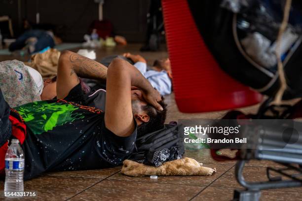 People seeking shelter from the heat rest at the First Congregational United Church of Christ cooling center on July 14, 2023 in Phoenix, Arizona....