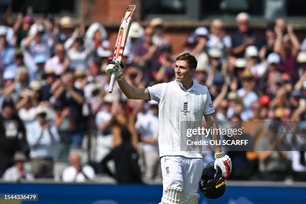 England's Zak Crawley celebrates his hundred on day two of the fourth Ashes cricket Test match between England and Australia at Old Trafford cricket...