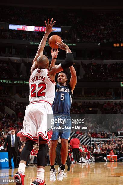 Will Conroy of the Minnesota Timberwolves shoots against Taj Gibson of the Chicago Bulls during the NBA preseason game on October 19, 2012 at the...