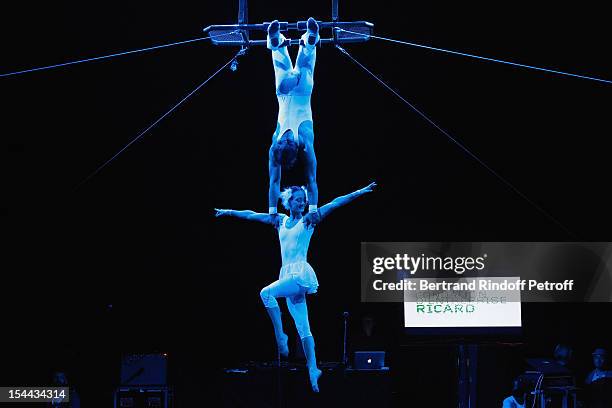 Artists from the 'Cirque En Chantier' circus perform an act prior to 'Bal Jaune 2012' organized by the Ricard Corporate Foundation for Contemporary...