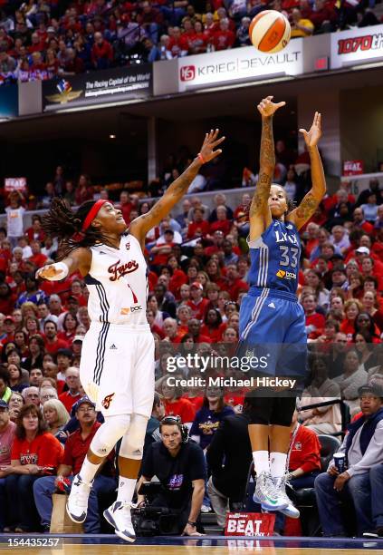 Seimone Augustus of the Minnesota Lynx shoots a jumper against Shavonte Zellous of the Indiana Fever during Game Three of the 2012 WNBA Finals on...