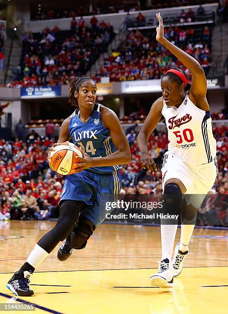 Devereaux Peters of the Minnesota Lynx dribbles to the hoop against Jessica Davenport of the Indiana Fever during Game Three of the 2012 WNBA Finals...