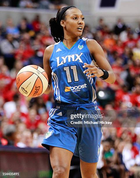 Candice Wiggins of the Minnesota Lynx dribbles the ball up court against the Indiana Fever during Game Three of the 2012 WNBA Finals on October 19,...