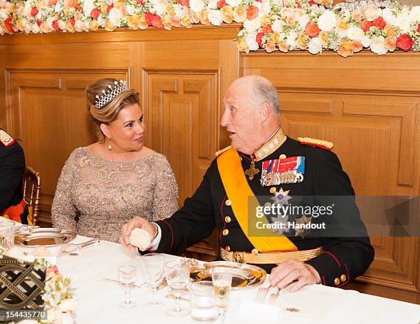 In this handout image provided by the Grand-Ducal Court of Luxembourg, Duchess Maria Teresa of Luxembourg and King Harald V of Norway attend a Gala...