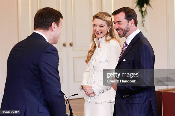In this handout image provided by the Grand-Ducal Court of Luxembourg, Mayor of Luxembourg Xavier Bettel speaks with Prince Guillaume of Luxembourg...