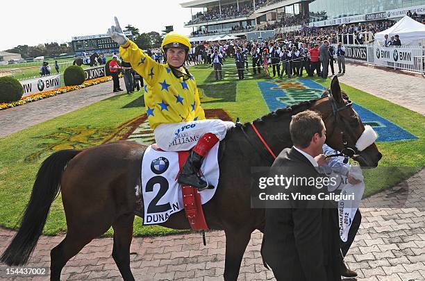 Jockey Craig Williams riding Dunaden celebrates after winning the BMW Caulfield Cup at Caulfield Racecourse on October 20, 2012 in Melbourne,...