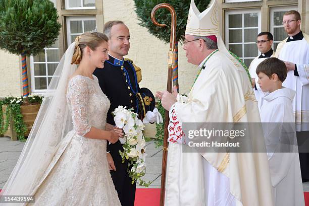 In this handout image provided by the Grand-Ducal Court of Luxembourg, Stephanie de Lannoy and her brother Count Jehan de Lannoy greet Most Reverend...