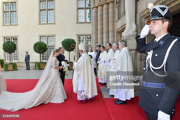 In this handout image provided by the Grand-Ducal Court of Luxembourg, Stephanie de Lannoy and her brother Count Jehan de Lannoy greet Most Reverend...