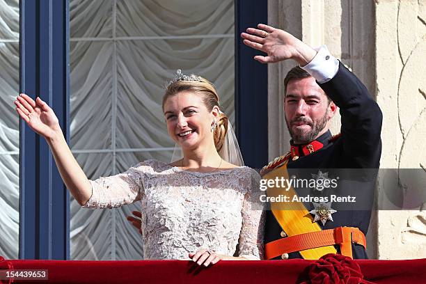 Princess Stephanie of Luxembourg and Prince Guillaume of Luxembourg wave to the crowds from the balcony of the Grand-Ducal Palace following the...