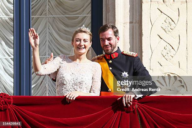 Princess Stephanie of Luxembourg and Prince Guillaume of Luxembourg wave to the crowds from the balcony of the Grand-Ducal Palace following the...