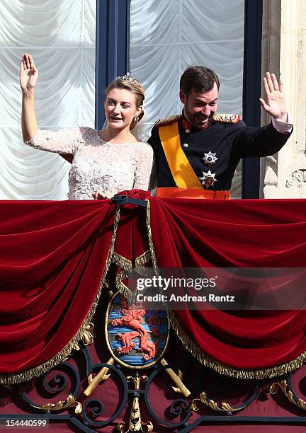 Princess Stephanie of Luxembourg and Prince Guillaume of Luxembourg wave to the crowds from the balcony of the Grand-Ducal Palace following the...