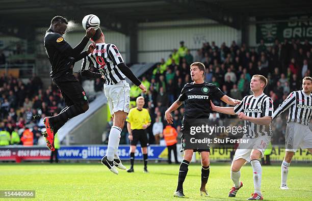 Celtic player Victor Wanyama rises above Steven Thompson to get in a header during the Clydesdale Bank Scottish Premier League match between St...