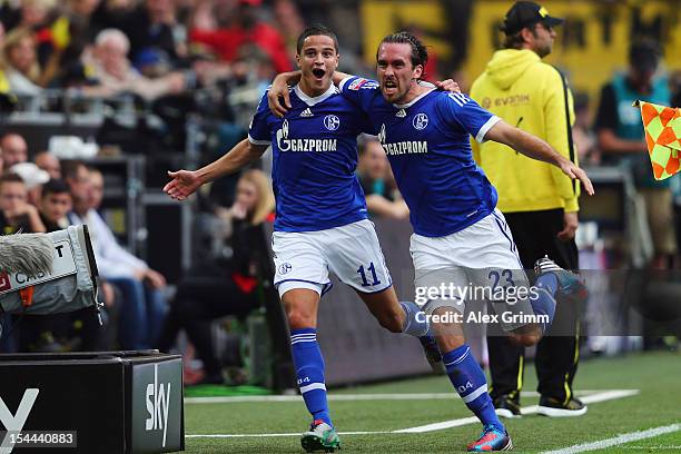 Ibrahim Affelay of Schalke celebrates his team's first goal with team mate Christian Fuchs during the Bundesliga match between Borussia Dortmund and...