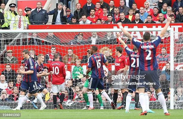 Ryan Shawcross of Stoke City celebrates Wayne Rooney of Manchester United scoring an own-goal during the Barclays Premier League match between...