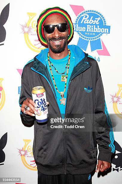 Snoop Dogg poses at the Snoop Dogg Presents: Colt 45 Works Every Time at The Playboy Mansion Party with Evan and Daren Metropulos on October 19, 2012...