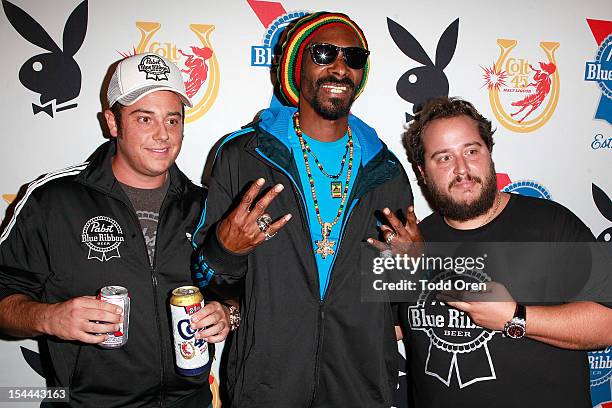 Snoop Dogg, Evan Metropoulos and Daren Metropoulos pose at the Snoop Dogg Presents: Colt 45 Works Every Time at The Playboy Mansion Party with Evan...