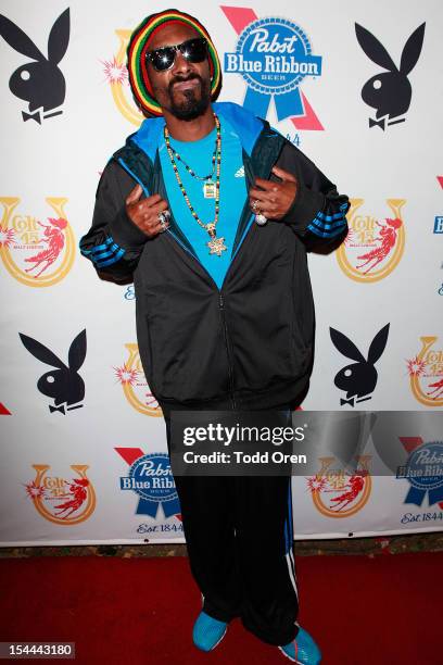 Snoop Dogg poses at the Snoop Dogg Presents: Colt 45 Works Every Time at The Playboy Mansion Party with Evan and Daren Metropulos on October 19, 2012...