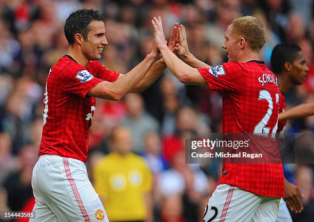 Robin van Persie of manchester United celebrates scoring to make it 2-1 with Paul Scholes during the Barclays Premier League match between Manchester...