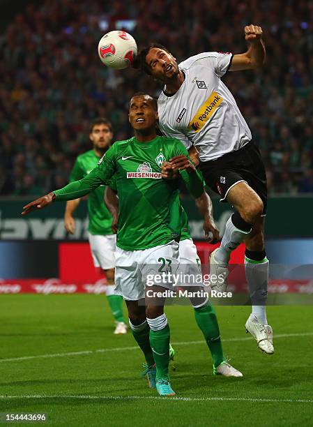 Theodor Gebre Selassie of Bremen and Martin Stranzl of Gladbach head for the ball during the Bundesliga match between Werder Bremen and Borussia...