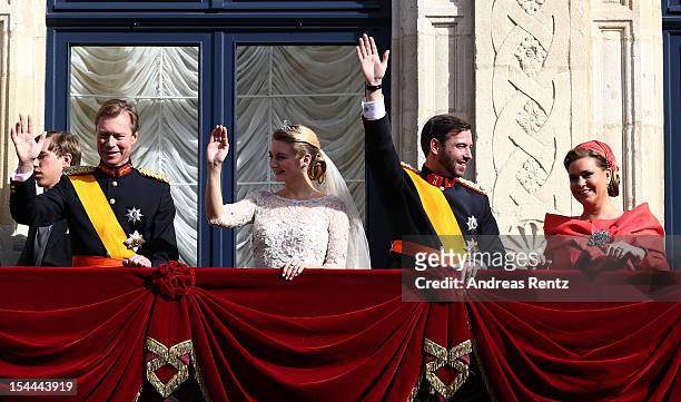 Grand Duke Henri of Luxembourg, Princess Stephanie of Luxembourg, Prince Guillaume Of Luxembourg and Grand Duchess Maria Teresa of Luxembourg wave to...