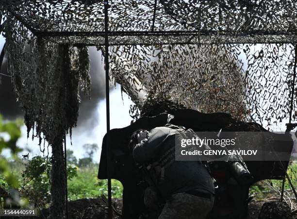 Ukrainian artilleryman fires a 152 mm towed gun-howitzer D-20 at Russian positions on the front line near Bakhmut, eastern Ukraine, on July 20 amid...