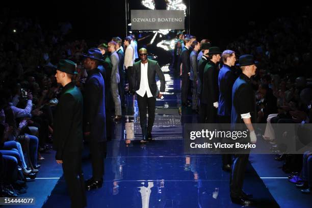 Designer Ozwald Boateng joins the models on the runway after the Ozwald Boateng Spring/Summer 2013 show on day 3 of Mercedes-Benz Fashion Week Russia...