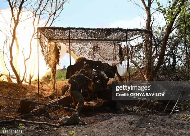 Ukrainian artilleryman fires a 152 mm towed gun-howitzer D-20 at Russian positions on the front line near Bakhmut, eastern Ukraine, on July 20 amid...