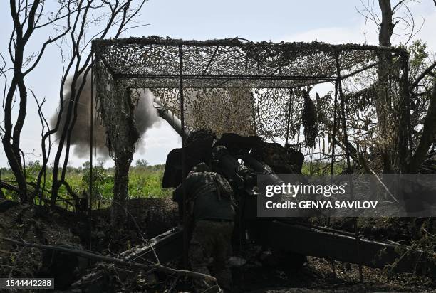 Ukrainian artilleryman fires a 152 mm towed gun-howitzer D-20 at Russian positions on the front line near Bakhmut, eastern Ukraine, on July 20 amid...